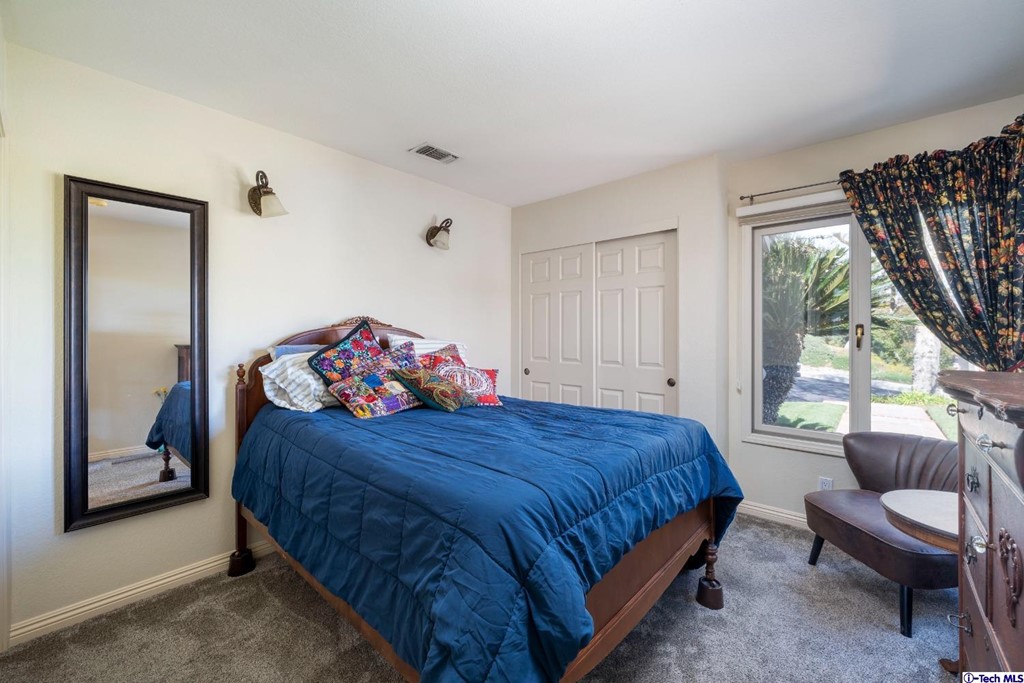 24718 Sagecrest Circle Newhall, CA 91381 - Photo 25 of 36 a bedroom with a bed and a couch
