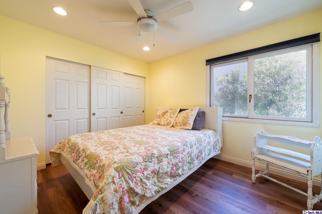 24718 Sagecrest Circle Newhall, CA 91381 - Photo 34 of 36 a bedroom with a bed and a window