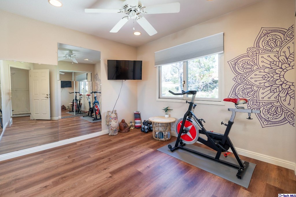24718 Sagecrest Circle Newhall, CA 91381 - Photo 35 of 36 a view of a livingroom with furniture gym equipment