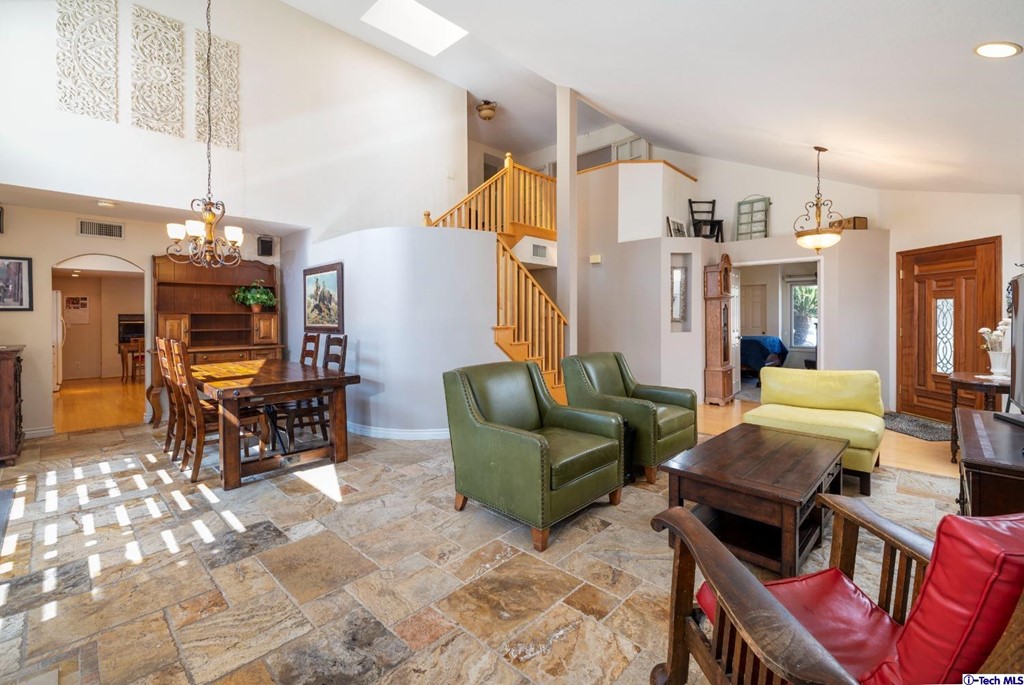 24718 Sagecrest Circle Newhall, CA 91381 - Photo 5 of 36 a living room with furniture and a chandelier