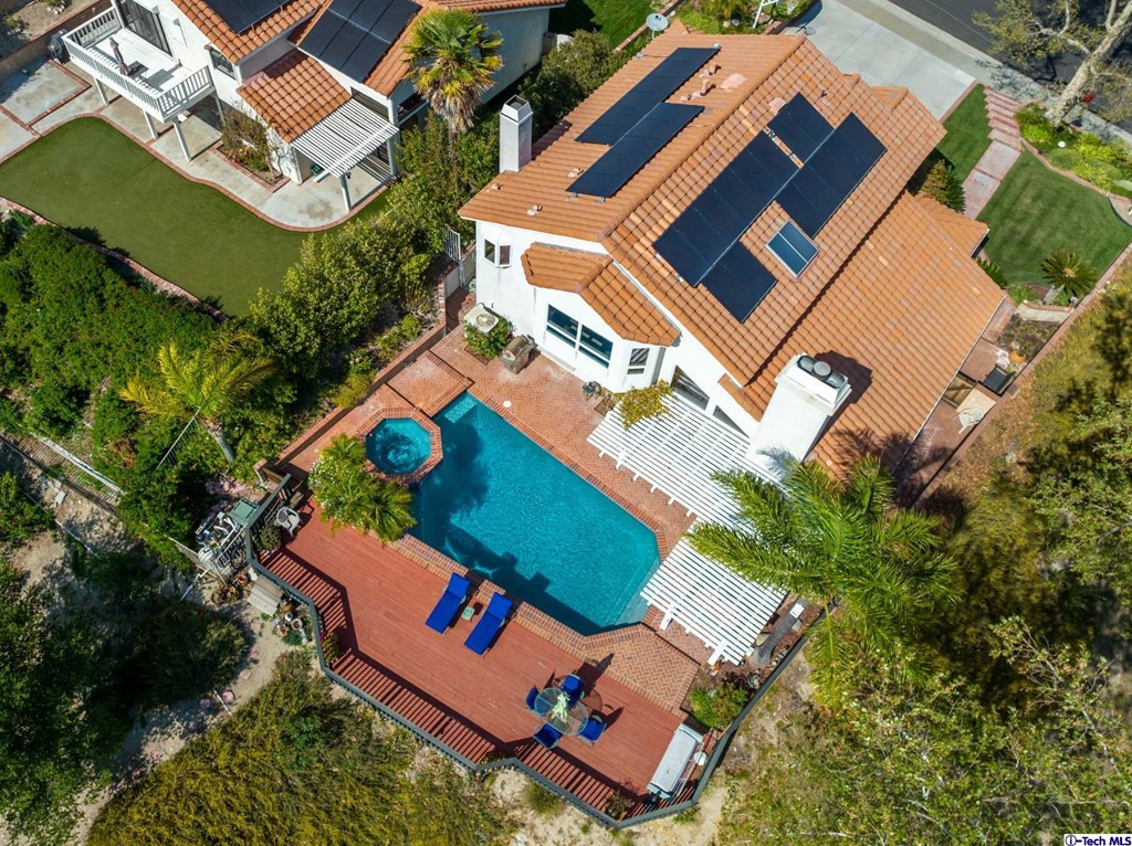 24718 Sagecrest Circle Newhall, CA 91381 - Photo 8 of 36 an aerial view of a house with a yard
