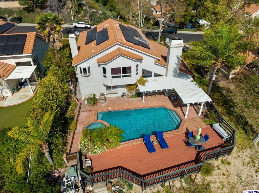 24718 Sagecrest Circle Newhall, CA 91381 - Photo 10 of 36 an aerial view of a house with swimming pool and patio