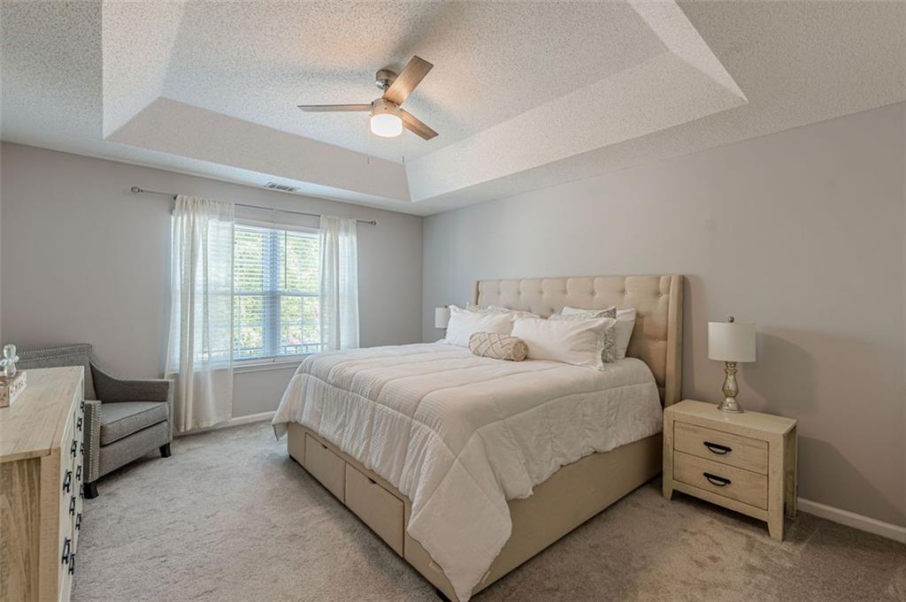 7640 Rutgers Circle Fairburn, GA 30213 - Photo 26 of 49 a bed room with a bed and a window