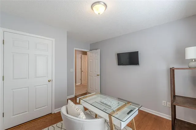 a room with furniture and wooden floor