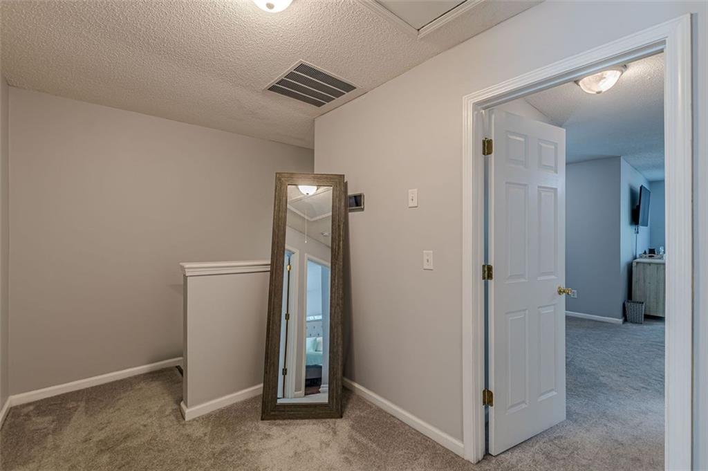 7640 Rutgers Circle Fairburn, GA 30213 - Photo 31 of 49 a view of a hallway with closet