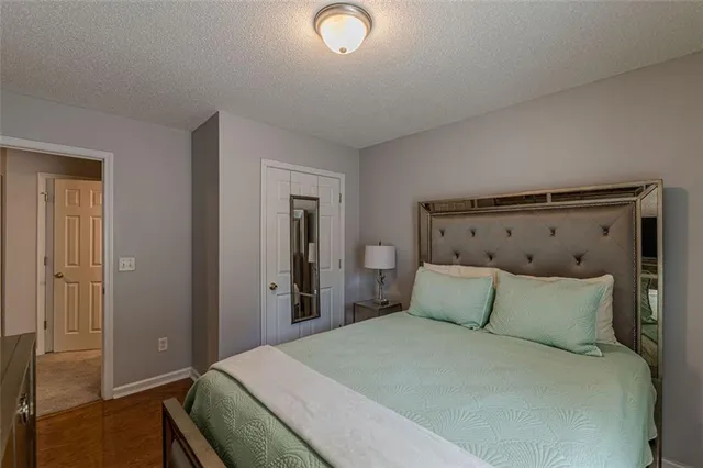 a hotel room with a bed and a flat screen tv