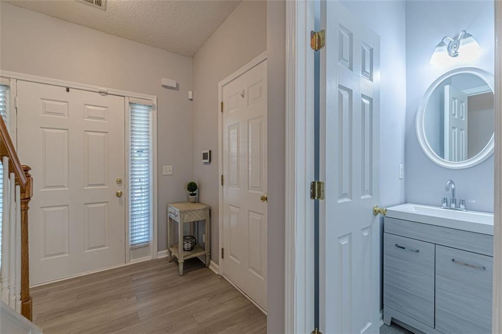 7640 Rutgers Circle Fairburn, GA 30213 - Photo 9 of 49 a en suite bathroom with a sink mirror and shower