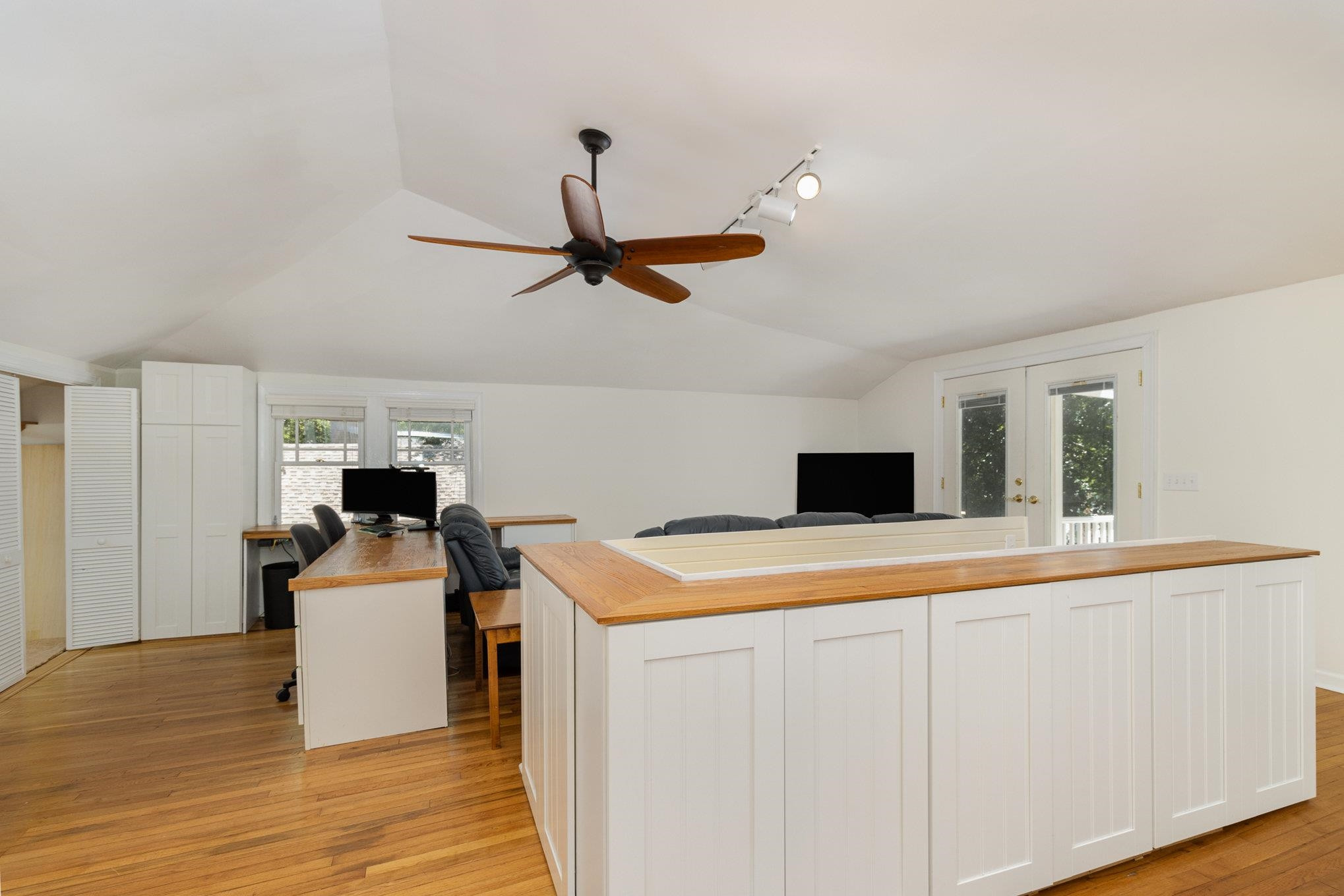 301 Duncan Street Raleigh, NC 27608 - Photo 26 of 41 This big room also serves as a terrific Office with views out back of the trees and another huge closet. Notice the cabinets all around the staircase for books and storage. Bonus Room