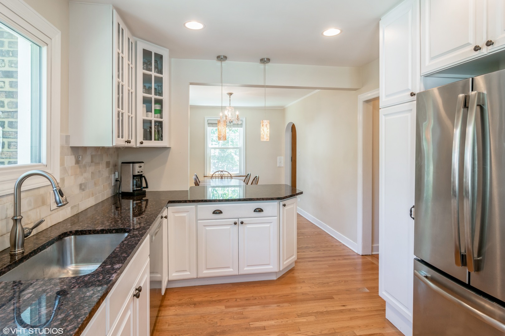 528 Selborne Road Riverside, IL 60546 - Photo 7 of 21 a kitchen with kitchen island granite countertop a sink appliances and cabinets