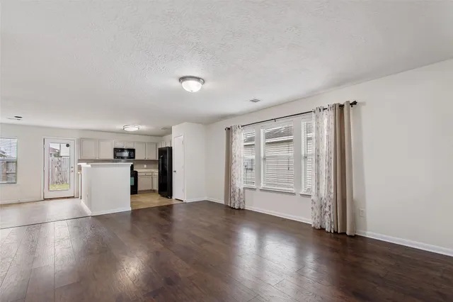 a kitchen with a sink cabinets and a window