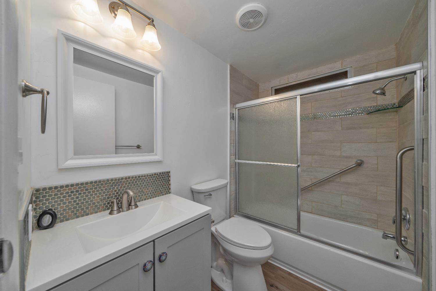 4420 Pleasant Valley Road, Unit 155 Diamond Springs, CA 95619 - Photo 32 of 42 a bathroom with a sink a toilet and shower