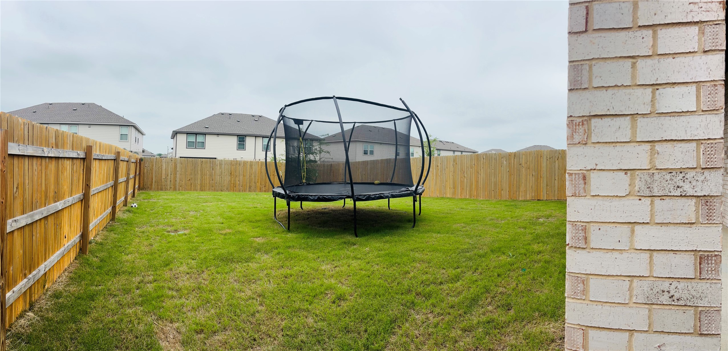 14817 Perlino Way, Unit A Manor, TX 78653 - Photo 34 of 40 a view of a garden with a slide