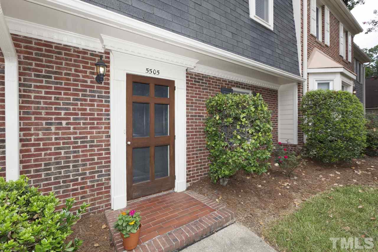 5505 Hamstead Crossing Raleigh, NC 27612 - Photo 2 of 25 a view of yellow house with a yard and potted plants