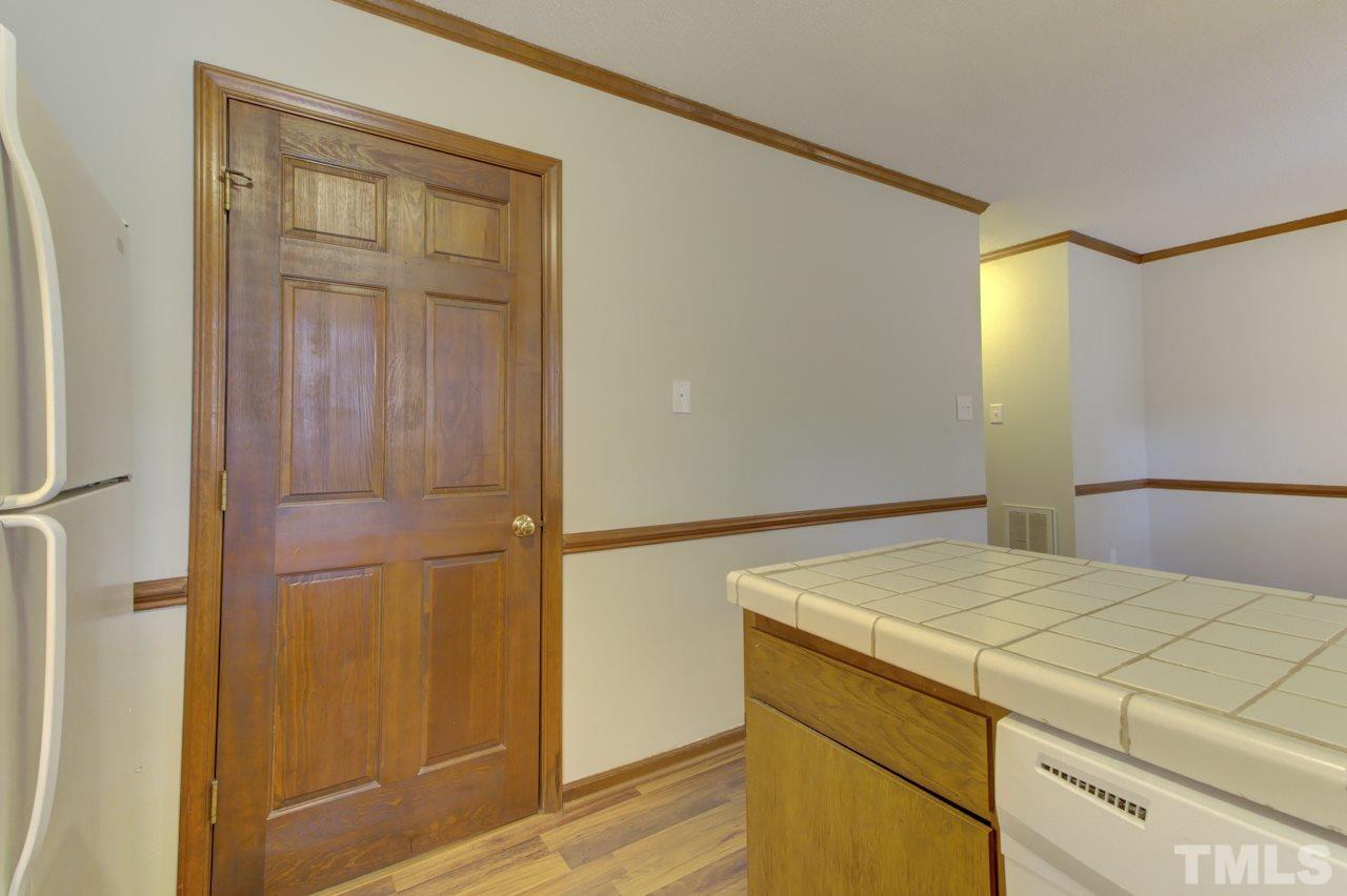 5505 Hamstead Crossing Raleigh, NC 27612 - Photo 12 of 25 a bedroom with a bed and cabinets