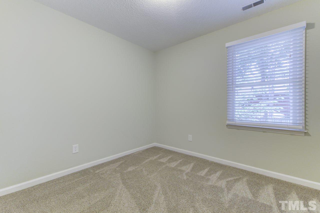 5505 Hamstead Crossing Raleigh, NC 27612 - Photo 18 of 25 an empty room with a window