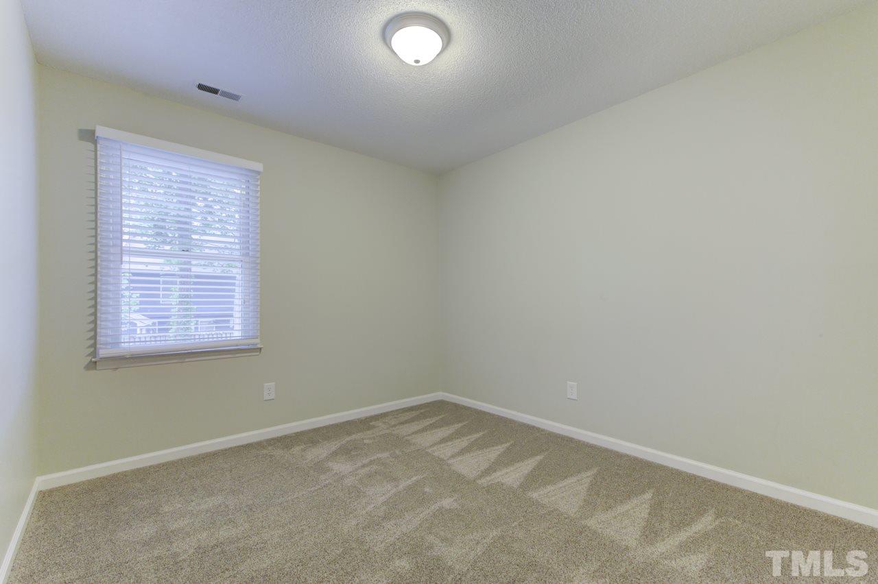 5505 Hamstead Crossing Raleigh, NC 27612 - Photo 21 of 25 an empty room with a window
