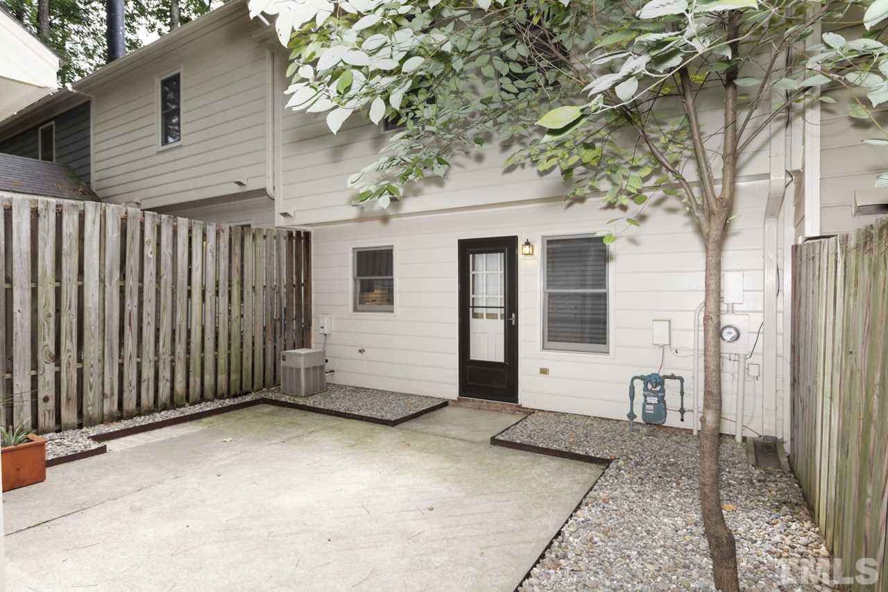 5505 Hamstead Crossing Raleigh, NC 27612 - Photo 22 of 25 a view of a house with a backyard