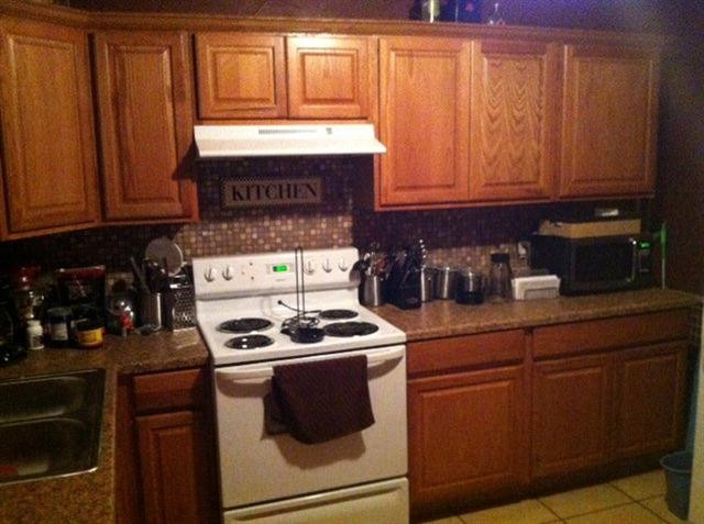1908 62nd Street Lubbock, TX 79412 - Photo 3 of 10 a kitchen with granite countertop cabinets stainless steel appliances and a sink