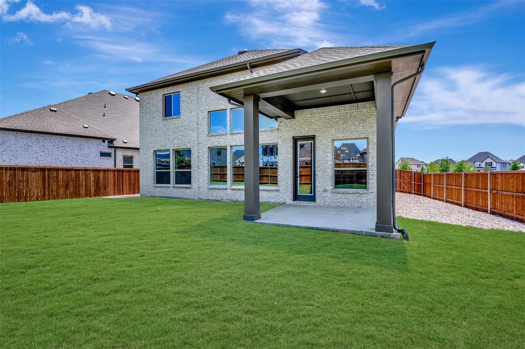 4308 Palomino Road Aubrey, TX 76227 - Photo 2 of 40 front view of a house with a yard