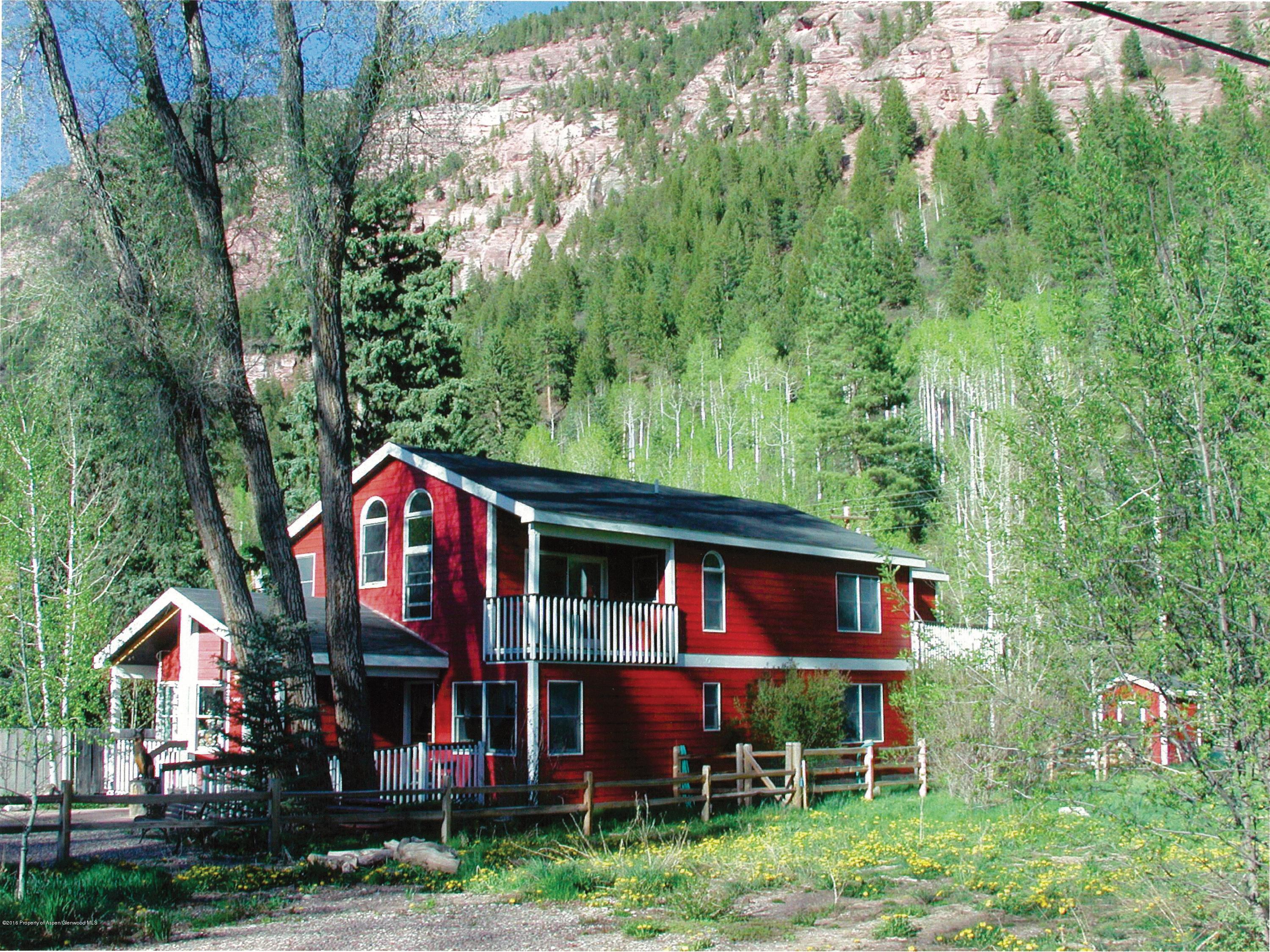 450 Redstone Boulevard Redstone, CO 81623 - Photo 1 of 16 a front view of a house with yard and staircase