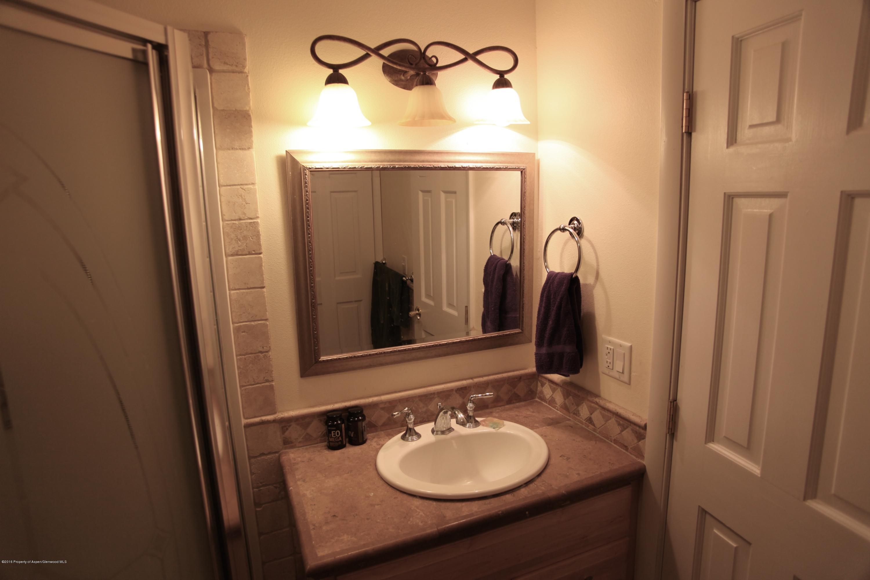 450 Redstone Boulevard Redstone, CO 81623 - Photo 11 of 16 a bathroom with a sink and a mirror