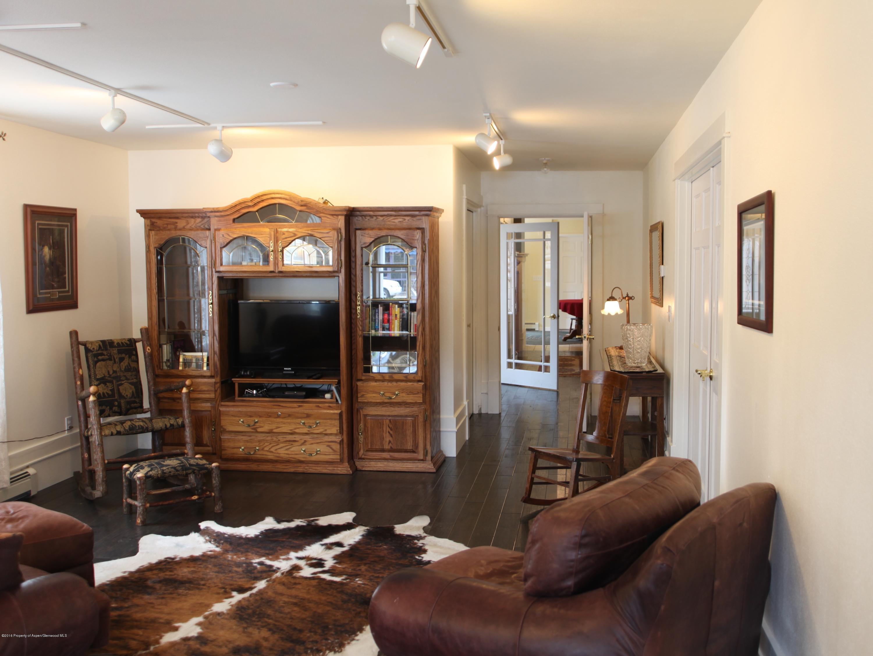 450 Redstone Boulevard Redstone, CO 81623 - Photo 2 of 16 a living room with furniture and a flat screen tv