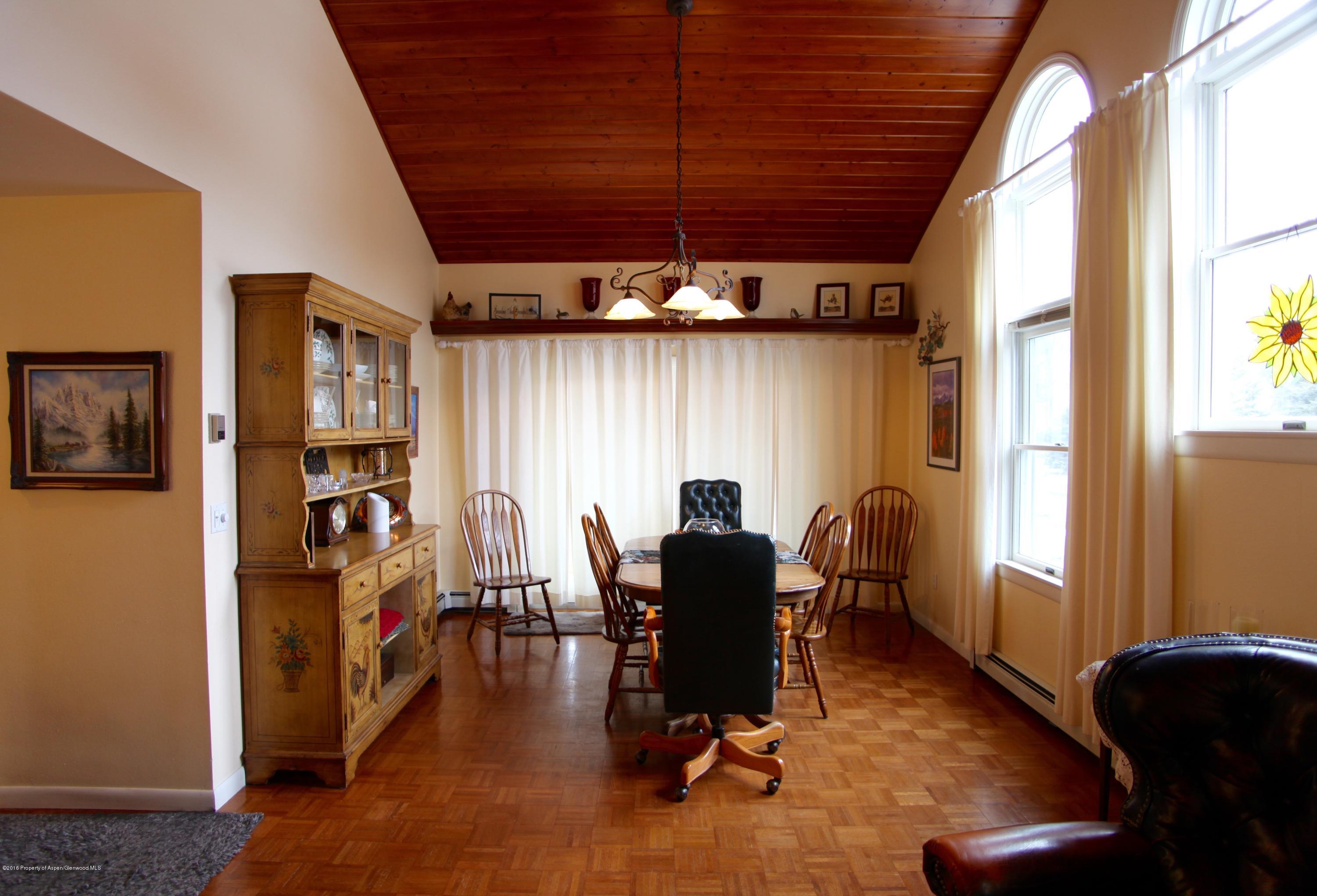 450 Redstone Boulevard Redstone, CO 81623 - Photo 4 of 16 a view of a dining room with furniture window and wooden floor