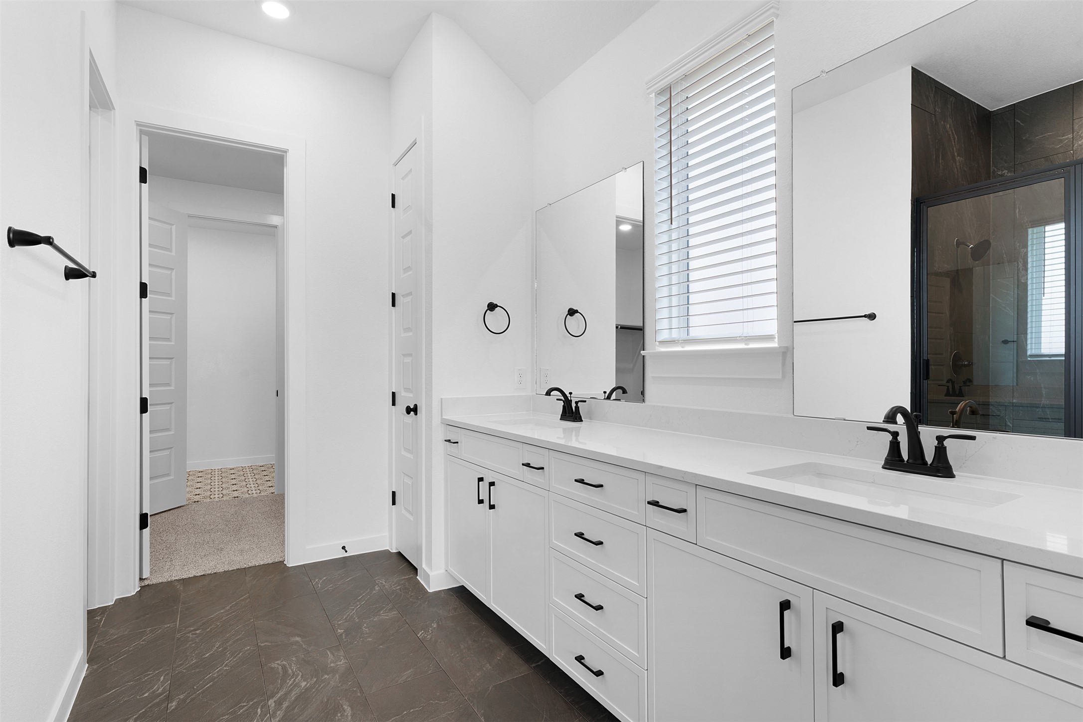 19504 Domino Champ Road Pflugerville, TX 78660 - Photo 15 of 24 Full bathroom featuring double vanity, a stall shower, and recessed lighting