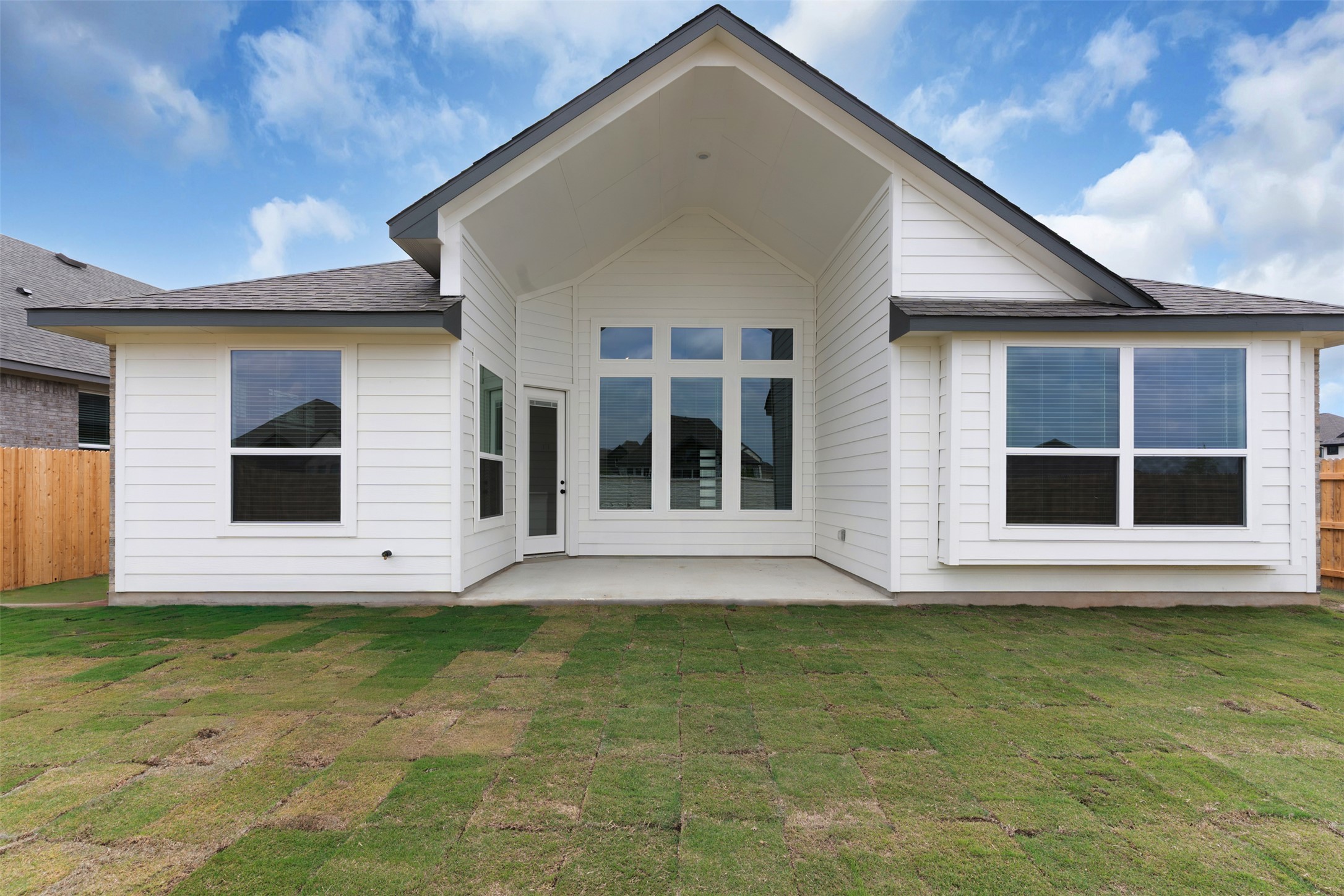 19504 Domino Champ Road Pflugerville, TX 78660 - Photo 18 of 24 Back of house with a patio and roof with shingles