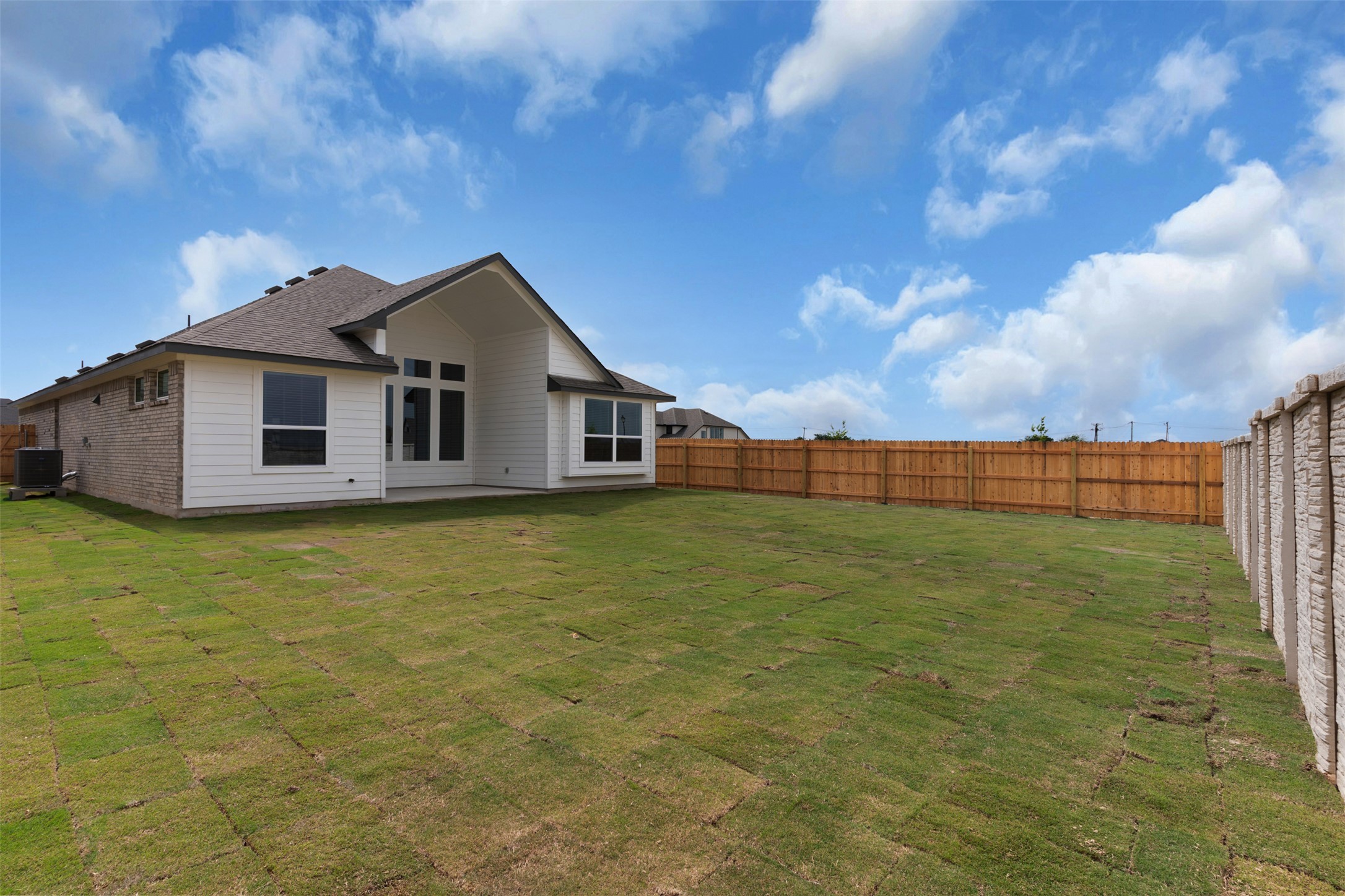 19504 Domino Champ Road Pflugerville, TX 78660 - Photo 19 of 24 Back of property featuring a patio and a fenced backyard
