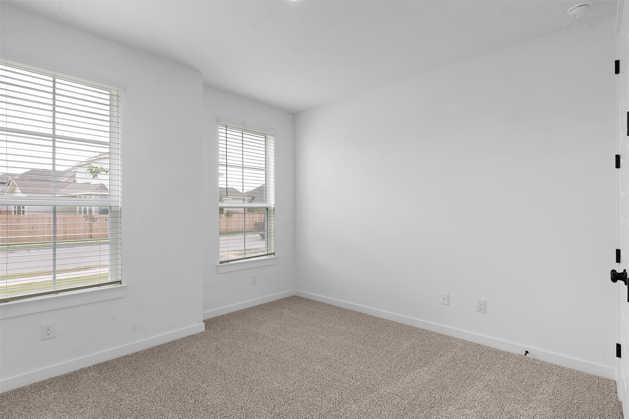 19504 Domino Champ Road Pflugerville, TX 78660 - Photo 4 of 24 Unfurnished room featuring baseboards and carpet floors