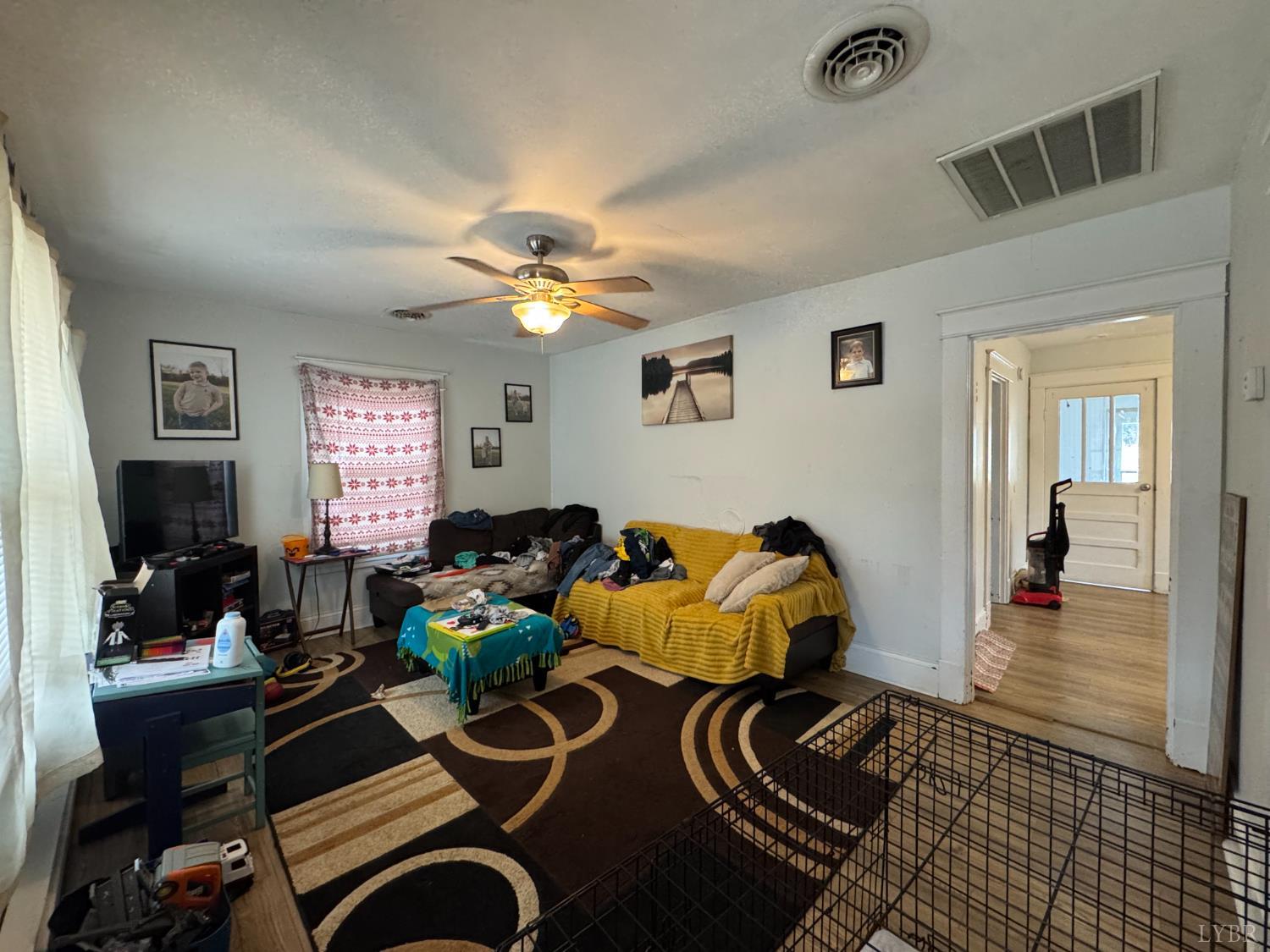 862 Oakville Road Appomattox, VA 24522 - Photo 5 of 13 a living room with furniture and a chandelier