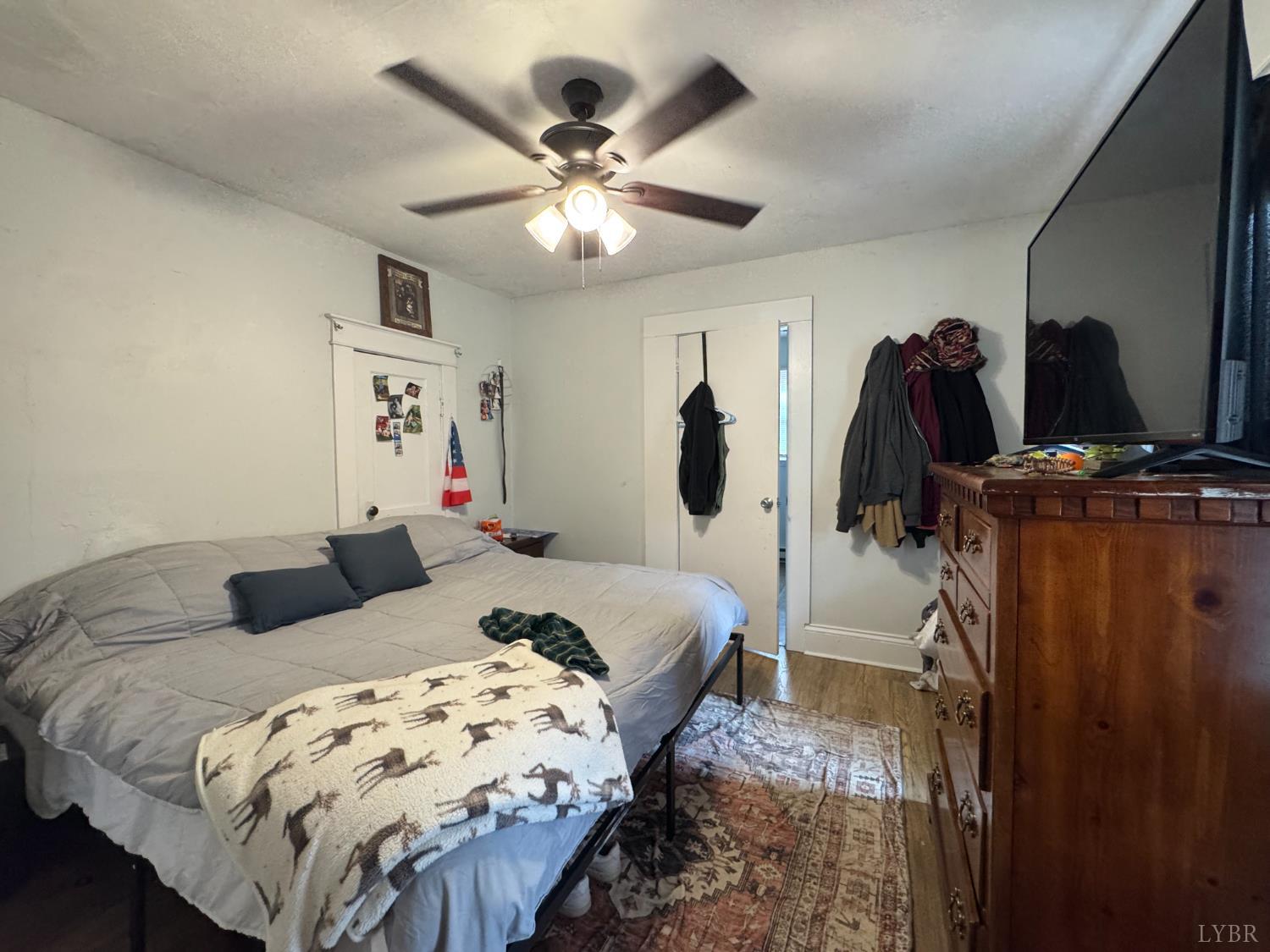 862 Oakville Road Appomattox, VA 24522 - Photo 6 of 13 a bedroom with bed and a chandelier