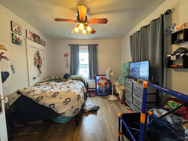a bedroom with bed and a window
