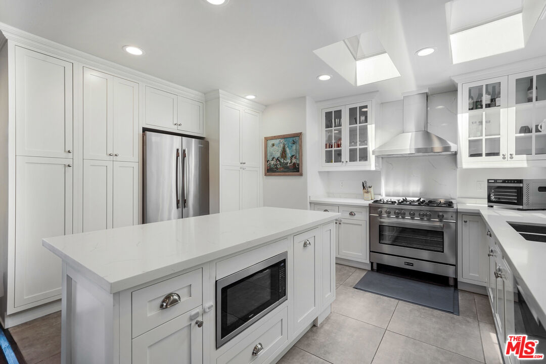 458 Rustic Drive Los Angeles, CA 90065 - Photo 19 of 41 a kitchen with a stove and a refrigerator