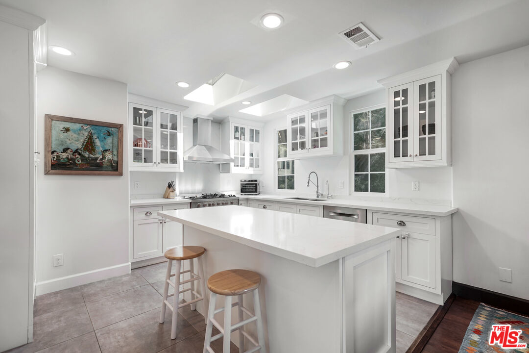 458 Rustic Drive Los Angeles, CA 90065 - Photo 20 of 41 a kitchen with a sink stove and cabinets