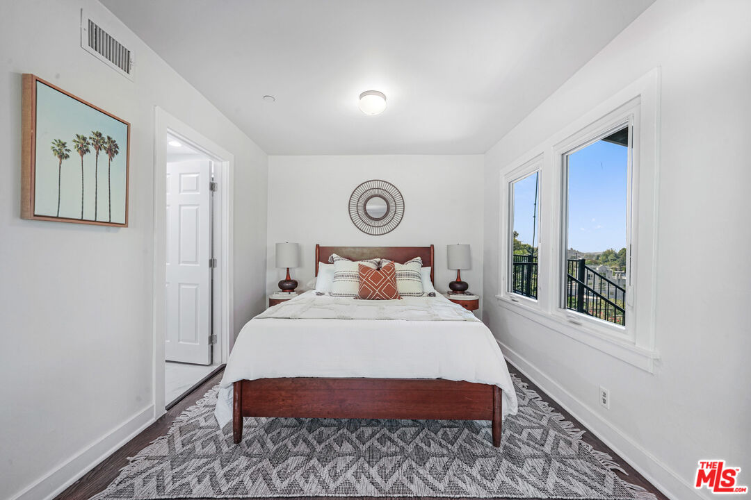 458 Rustic Drive Los Angeles, CA 90065 - Photo 40 of 41 a bed sitting in a bedroom next to a window