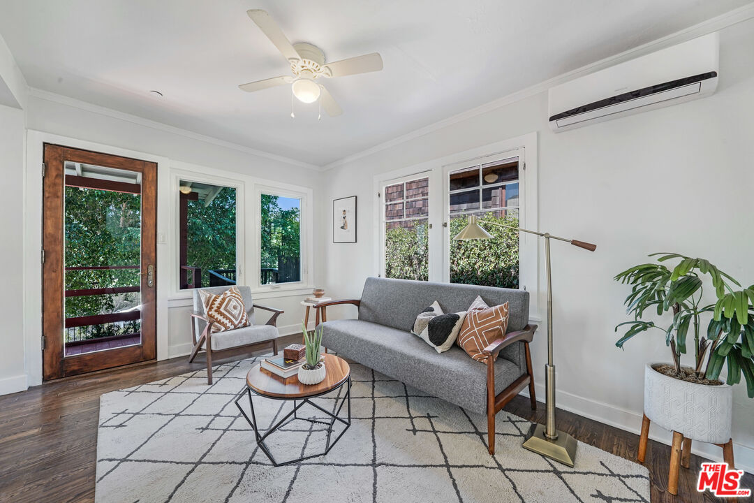 458 Rustic Drive Los Angeles, CA 90065 - Photo 6 of 41 a living room with patio furniture and a potted plant