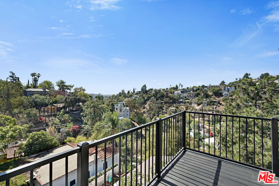 458 Rustic Drive Los Angeles, CA 90065 - Photo 10 of 41 a view of a balcony with wooden fence and floor