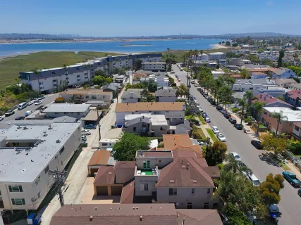 an aerial view of residential houses with outdoor space