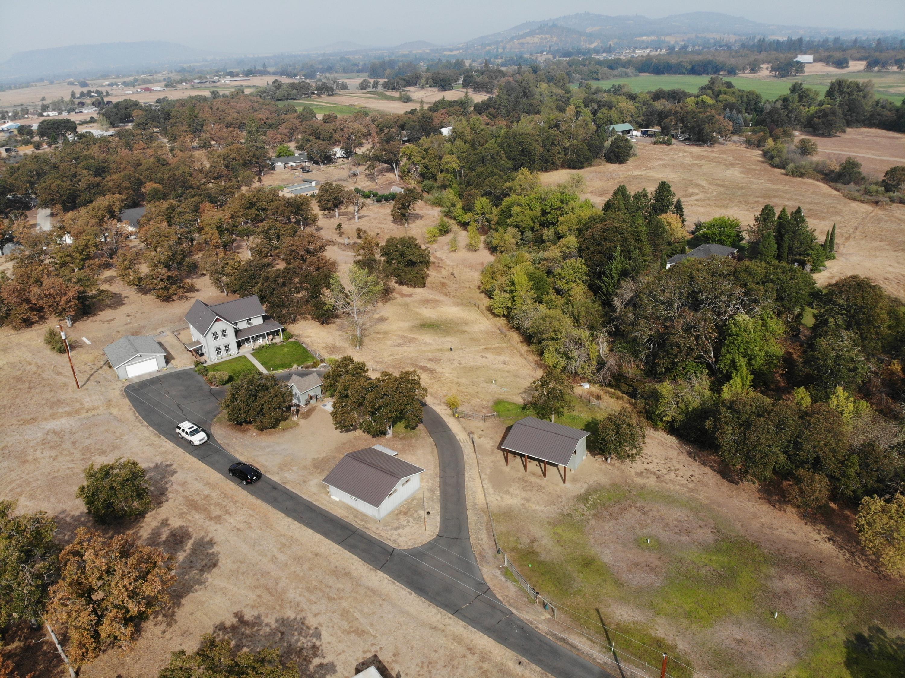 1023 Bigham Brown Road Eagle Point, OR 97524 - Photo 36 of 52 an aerial view of residential houses with outdoor space