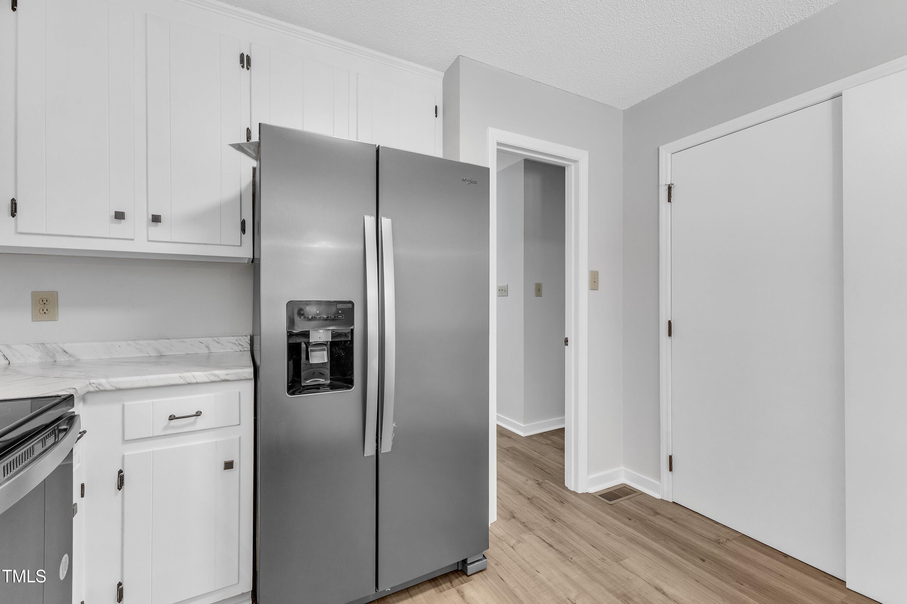 612 Miller Road Hillsborough, NC 27278 - Photo 14 of 35 a kitchen with stainless steel appliances granite countertop a refrigerator and a stove