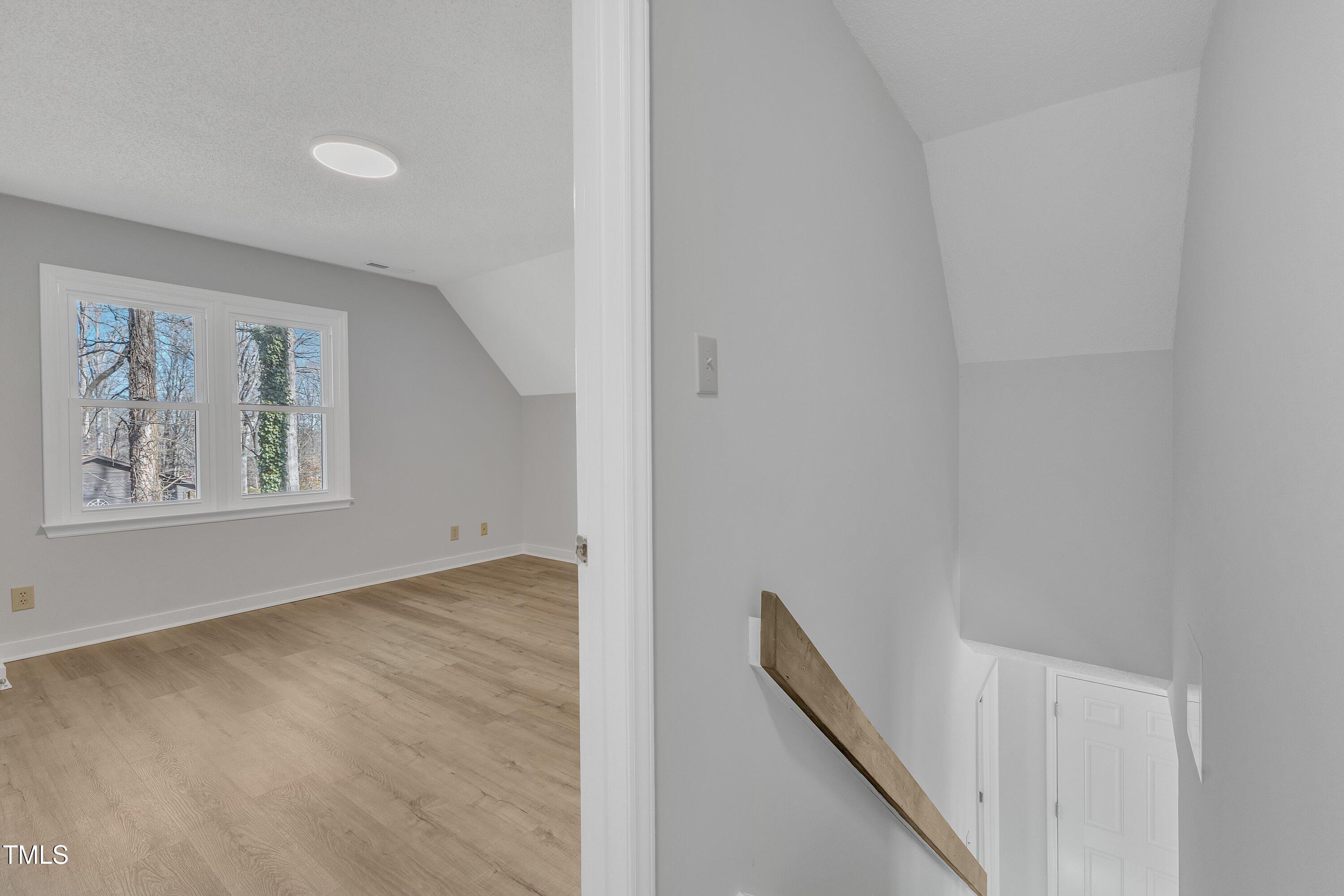 612 Miller Road Hillsborough, NC 27278 - Photo 18 of 35 a view of an empty room with window and hallway
