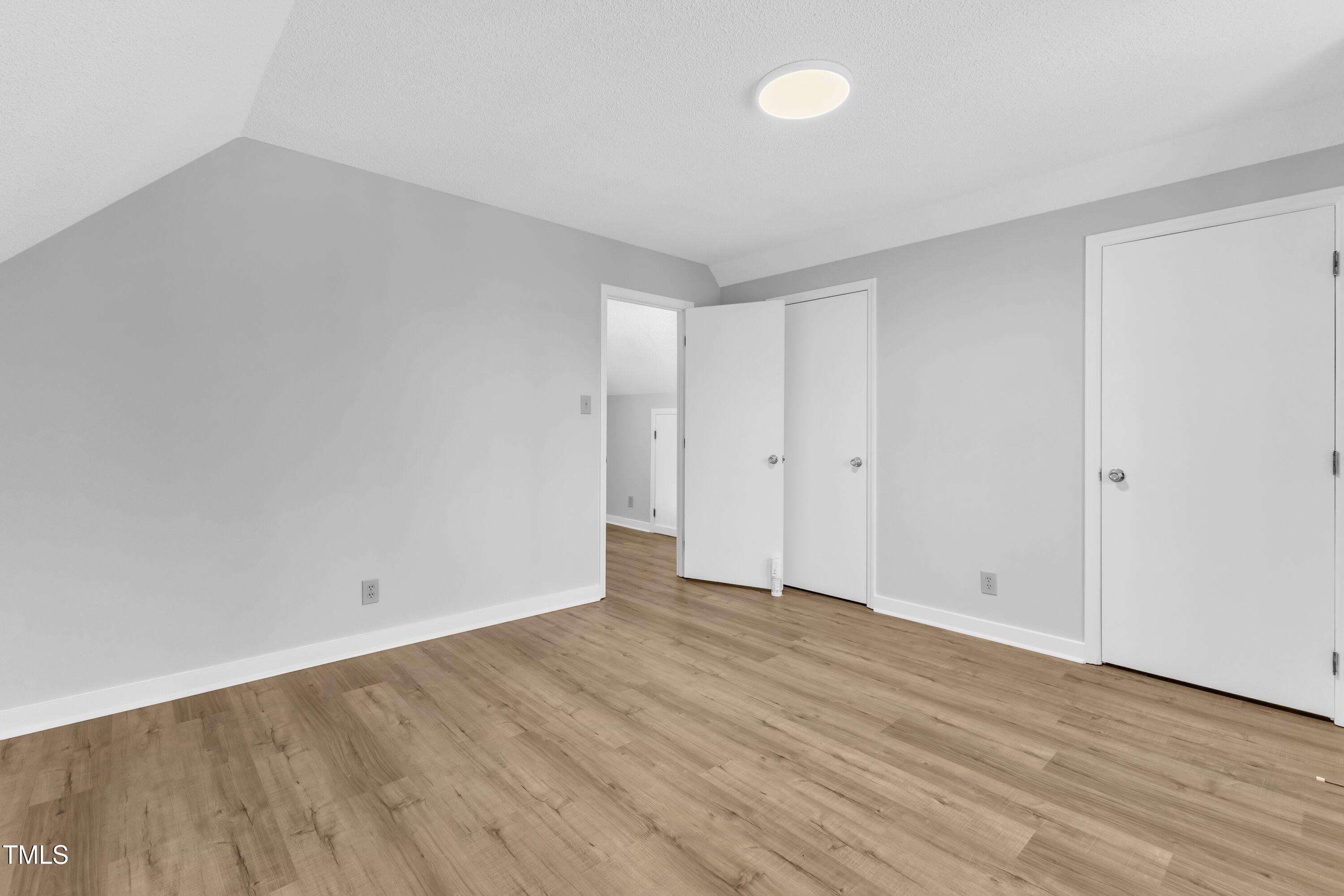 612 Miller Road Hillsborough, NC 27278 - Photo 20 of 35 a view of an empty room with wooden floor