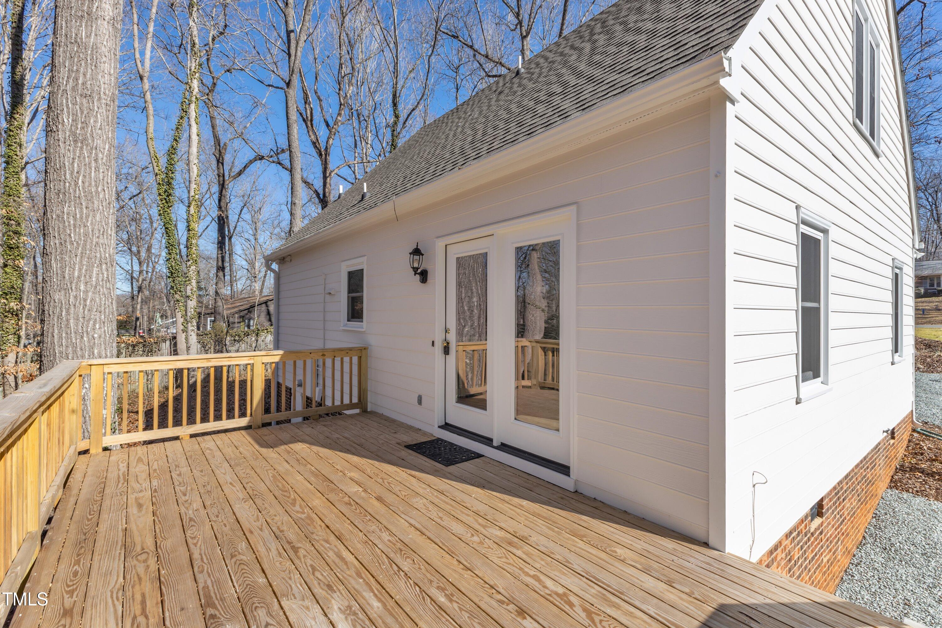 612 Miller Road Hillsborough, NC 27278 - Photo 24 of 35 a view of backyard with a deck and wooden floor