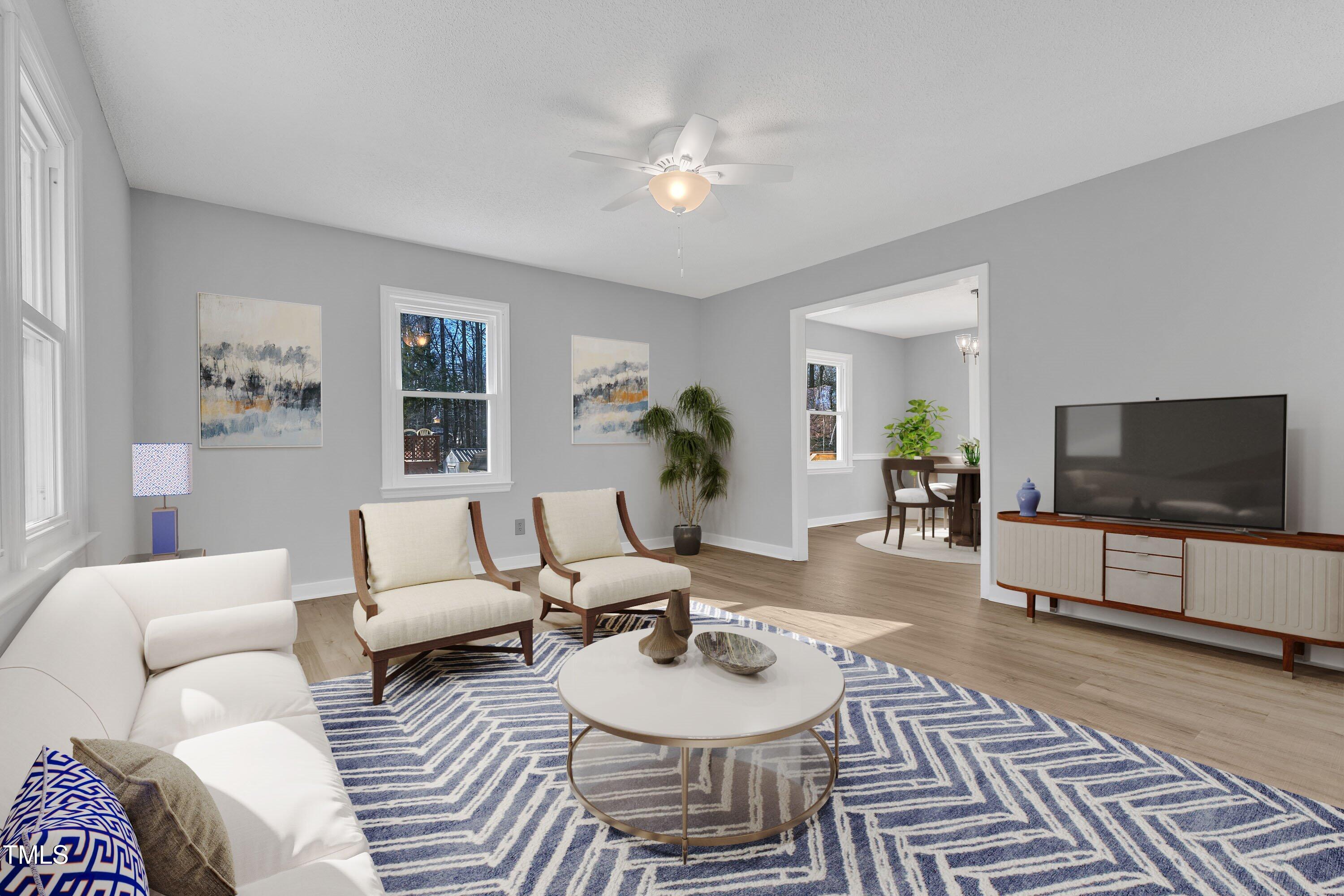 612 Miller Road Hillsborough, NC 27278 - Photo 5 of 35 a living room with furniture and a flat screen tv