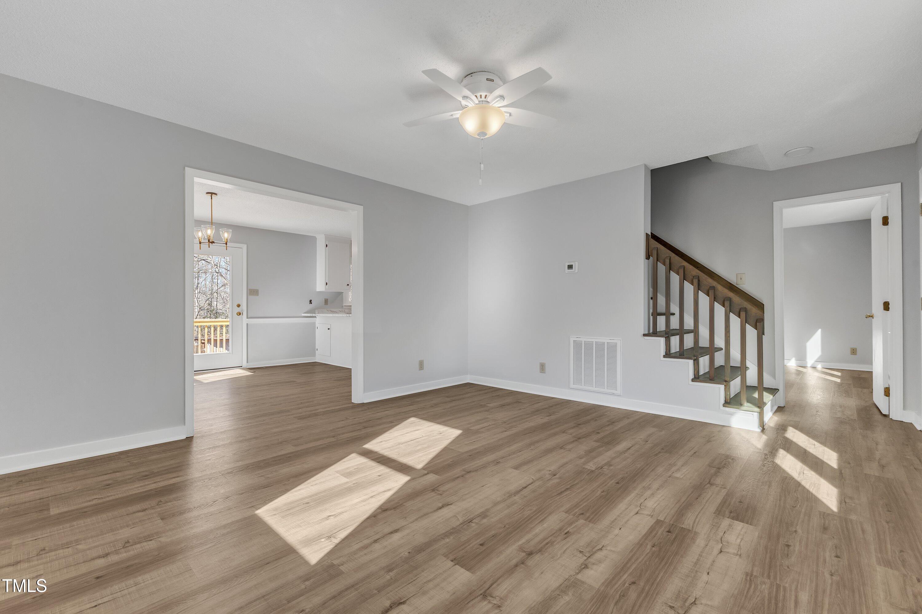 612 Miller Road Hillsborough, NC 27278 - Photo 6 of 35 a view of empty room with wooden floor and fan