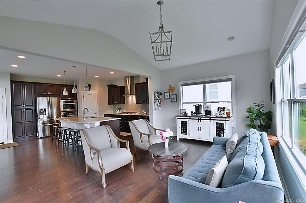 5271 Meadowcroft Way Fort Mill, SC 29708 - Photo 22 of 43 a living room with stainless steel appliances furniture and a wooden floor