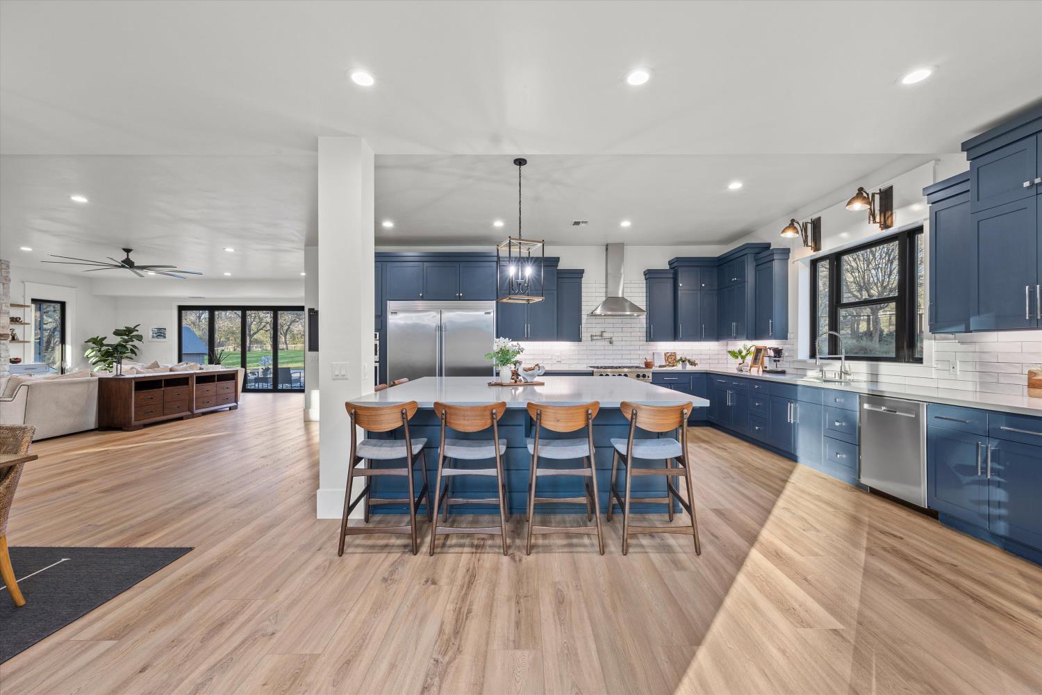 6620 Auburn Folsom Road Granite Bay, CA 95746 - Photo 19 of 69 a large kitchen with a table and chairs