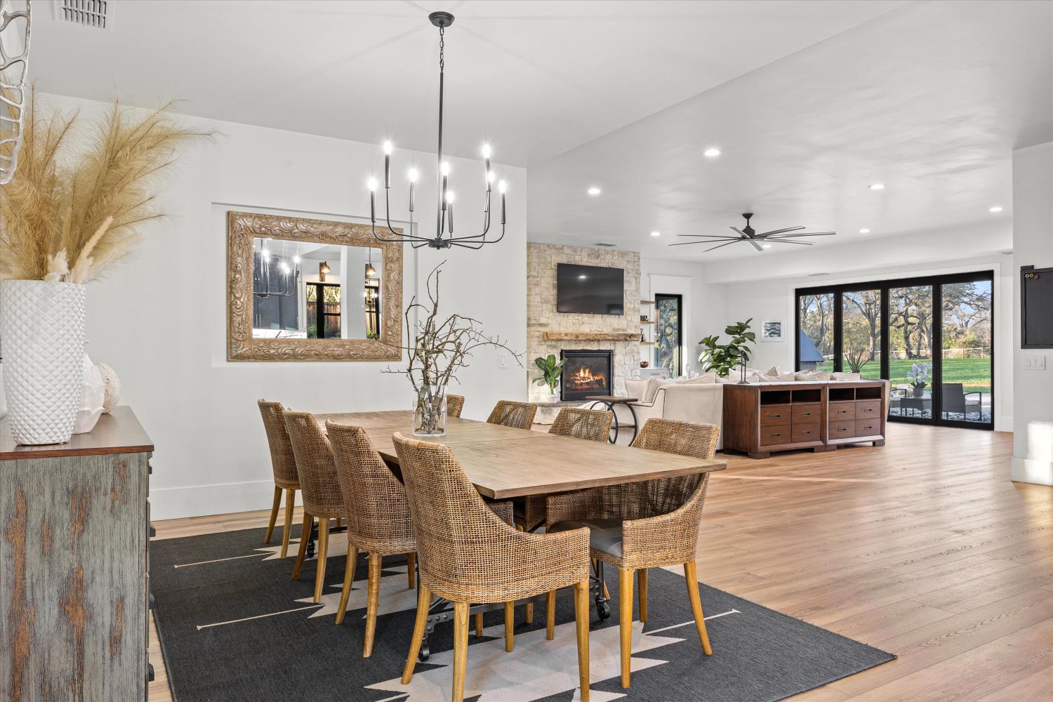 6620 Auburn Folsom Road Granite Bay, CA 95746 - Photo 21 of 69 a view of a dining room with furniture a chandelier and wooden floor